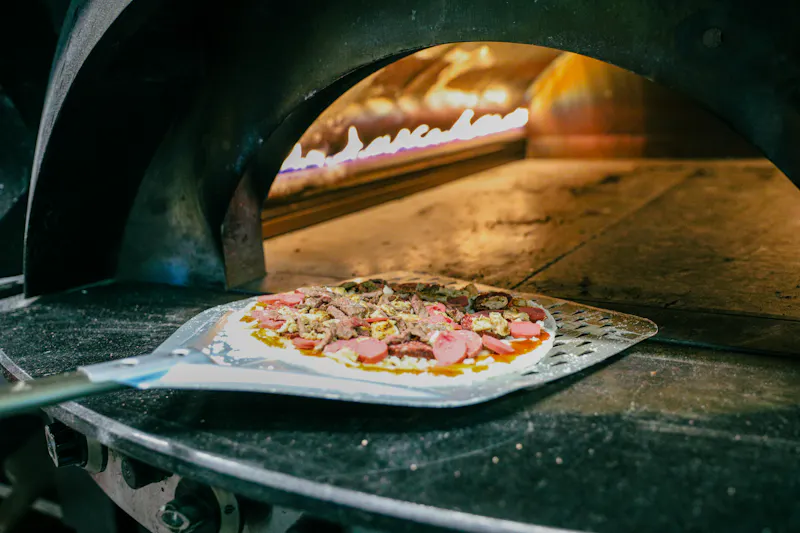 Our authentic Italian pizza kitchen with wood-fired oven